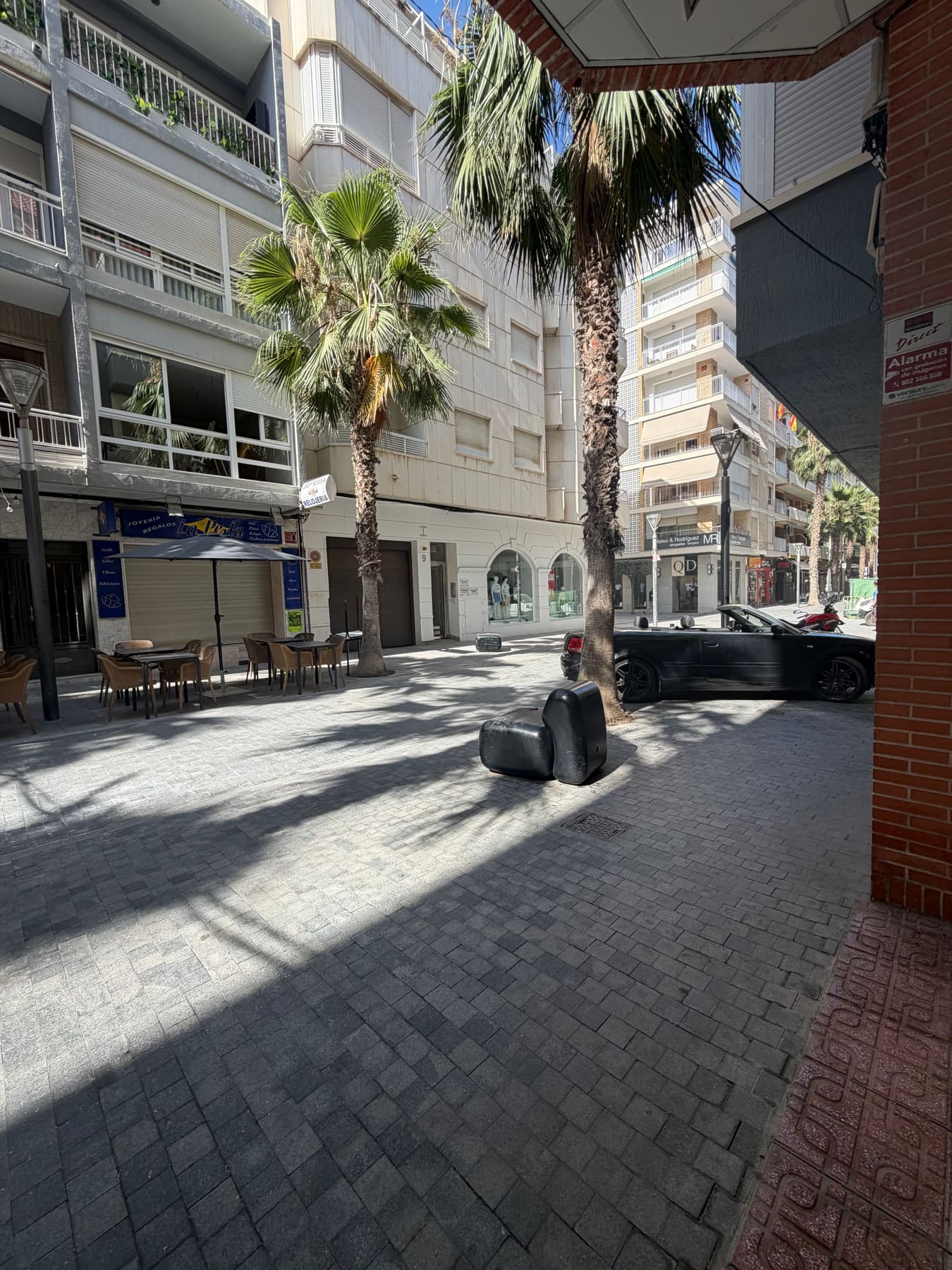 Calle Canónigo Torres, the pedestrian street outside the Milla Homes office